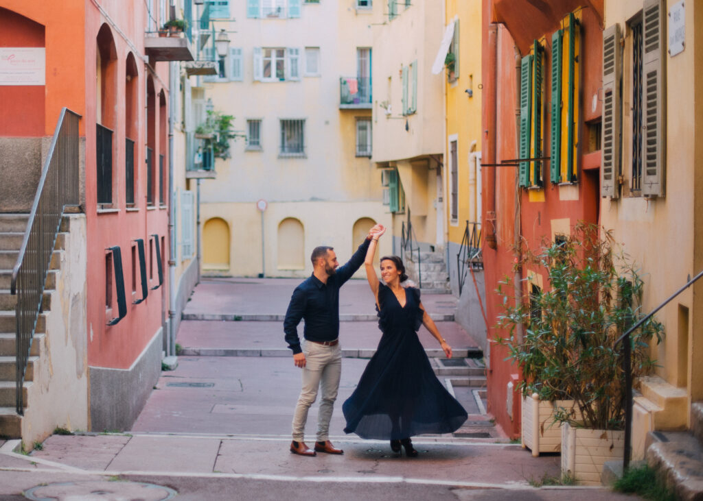 Portrait of couple during couple's photoshoot in old town in Nice, France. Photographed by Chiha Studios.