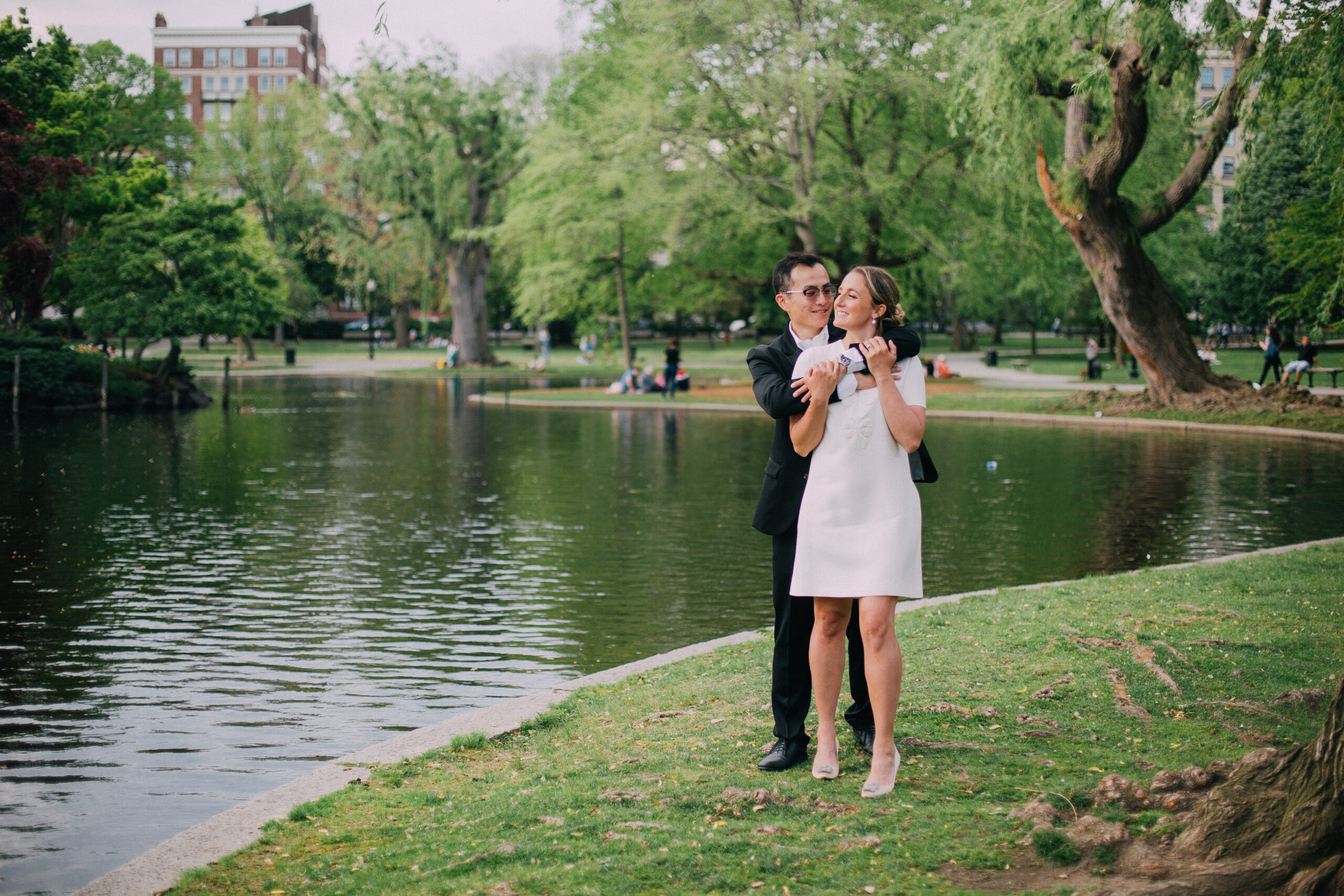 engagement photo of a couple in the springtime in boston public garden