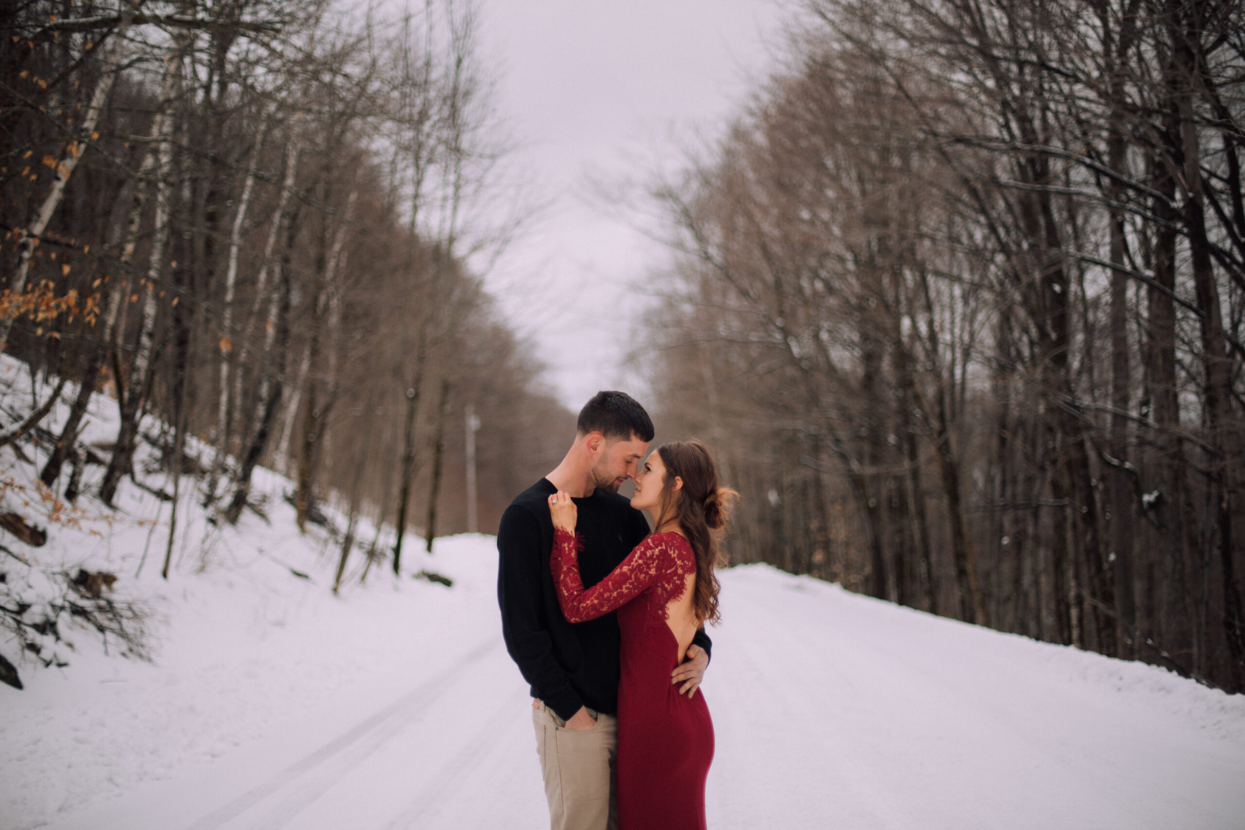 photo of a couple in the snow for their engagement session in Vermont