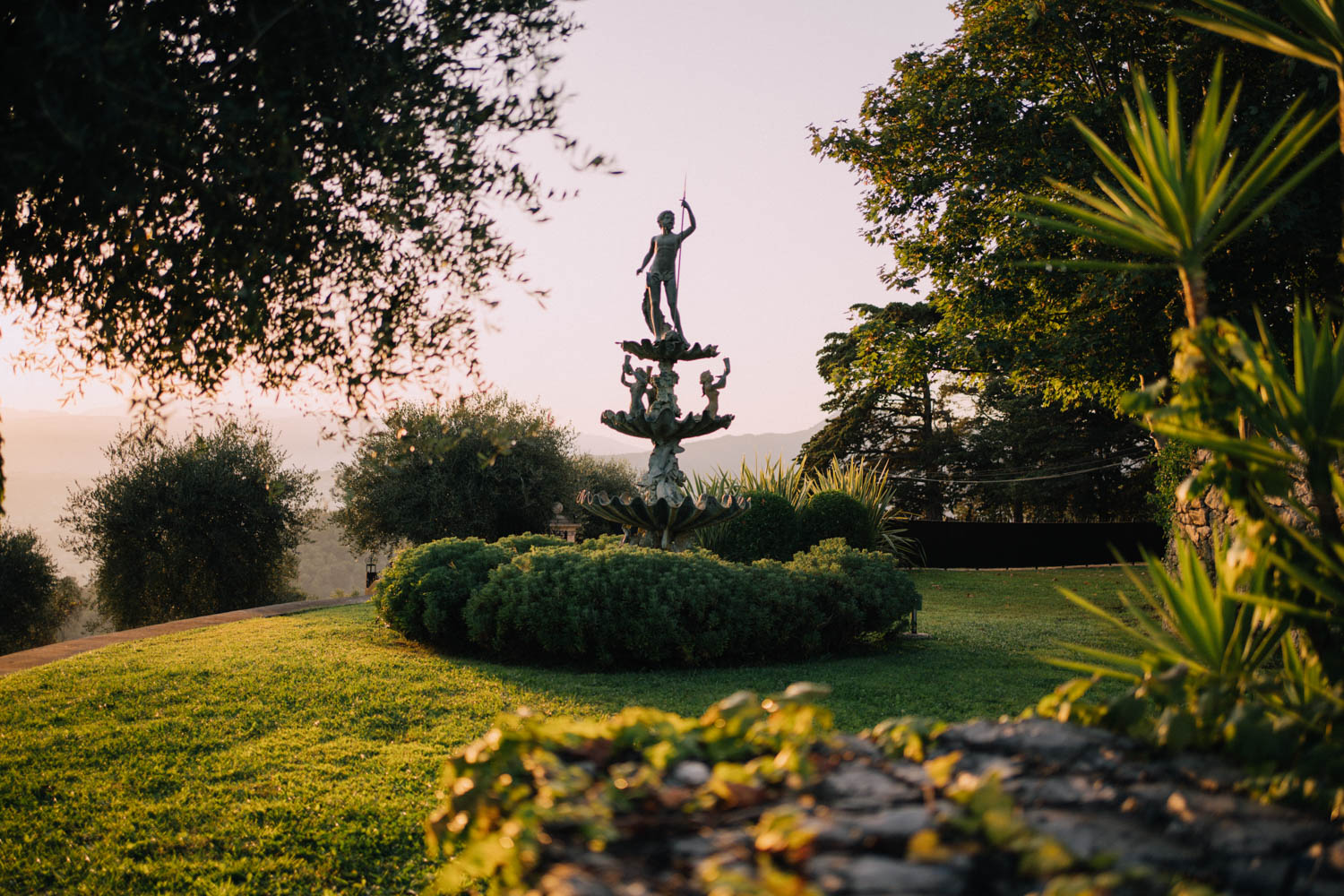 Details of a stunning garden statue at sunset